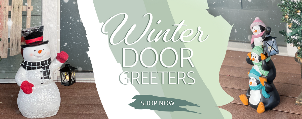 Snowman and Penguin Family holding Lanterns at door of home with text, "Winter Door Greeters, Shop Now"