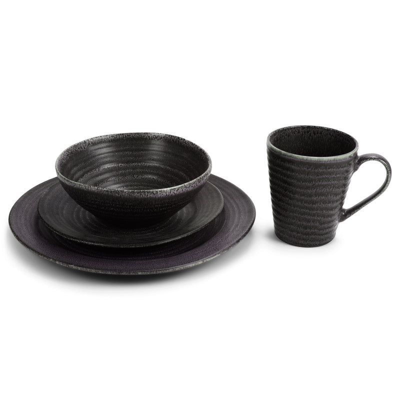 Bowl and small plate resting on top of large plate, mug to the side