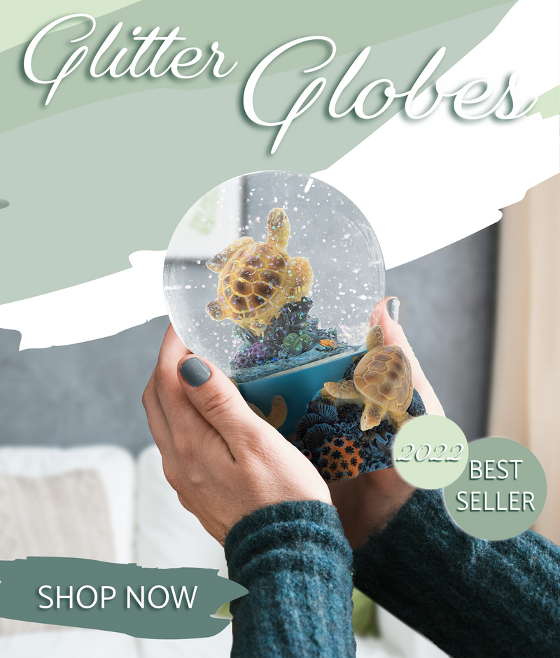 Sea Turtle Glitter globe being held by woman in home. Text "Glitter Globes 2022 Best Seller, Shop Now"