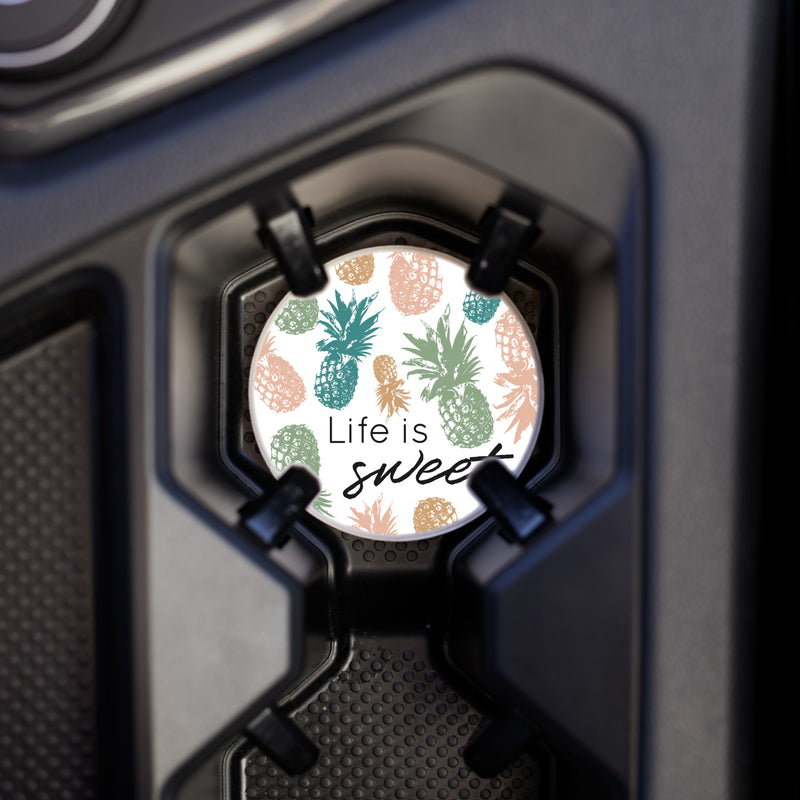 Coaster placed in the vehicles cup holder