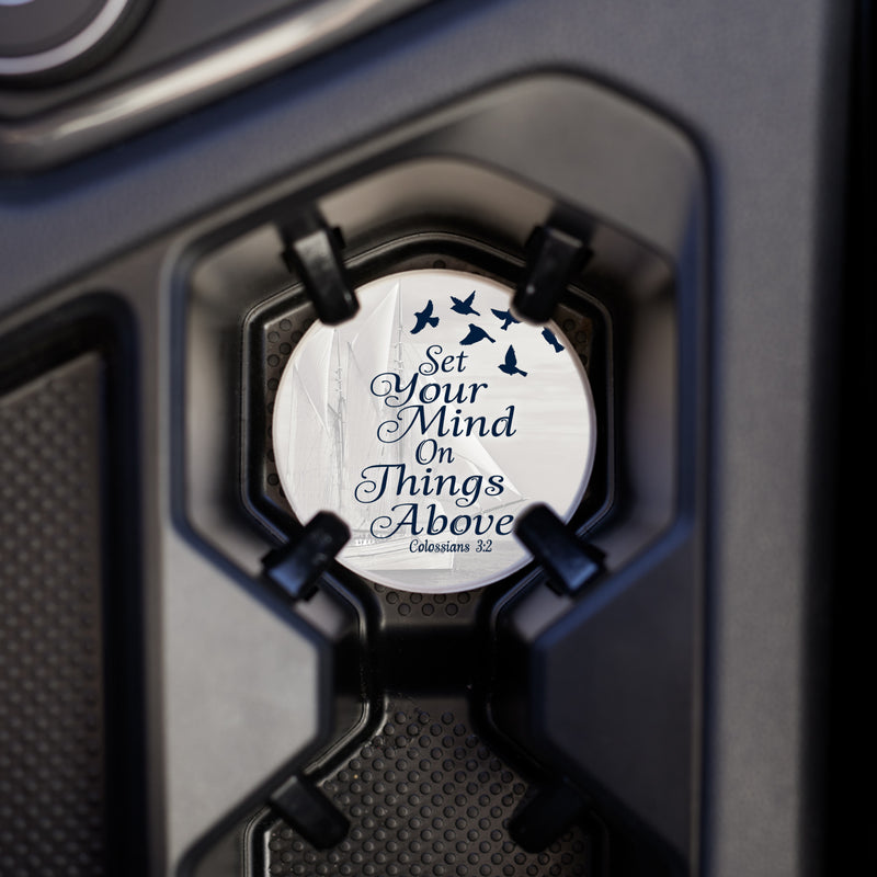 Coaster placed in the vehicles cup holder