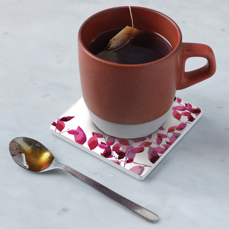 Cup of tea sitting on coaster in kitchen